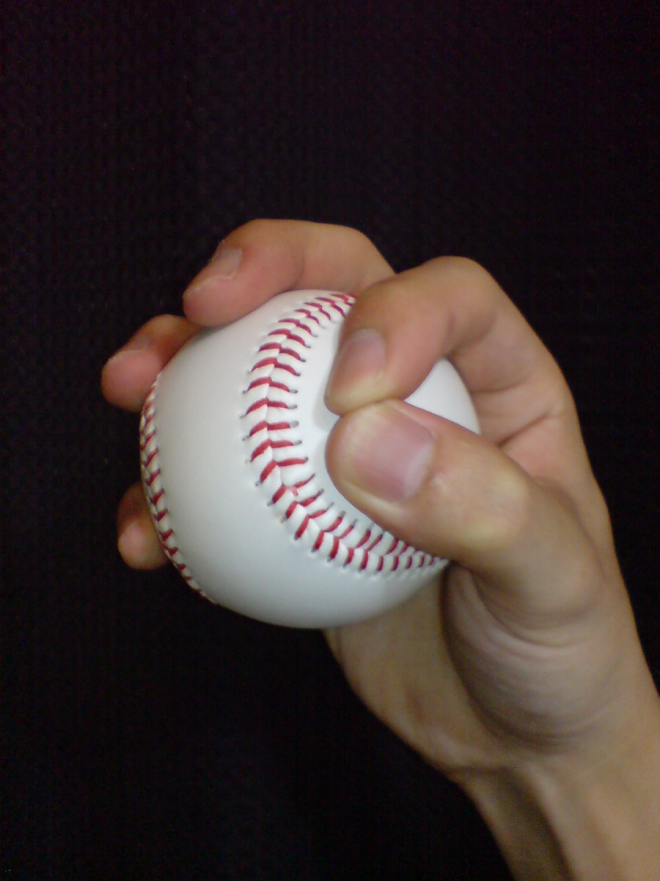 Circle grip example of Circle changeup; One actual circle-grip photograph and its enlarged detail. Thumb and index make the circle; remaining fingers support the ball. This is not a separate side-view photograph.